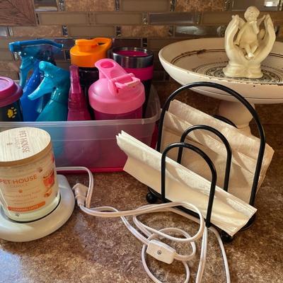 Spray bottles and mugs with candle, warmer and decorative bowl