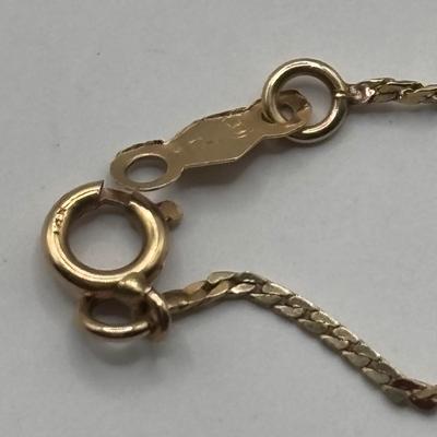 Lot 509J: 14K Gold Chain & 14K Heart Charm Tw 1.34g