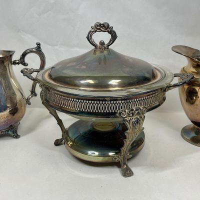 Sale Photo Thumbnail #70: Pitchers by WM Rogers and Portsmouth Silverplate, chafing dish has no markings. Chafing dish includes the clear glass Pyrex insert.  All in good condition with nice patina.