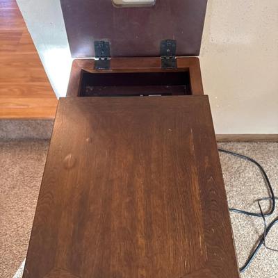 Wooden side table with outlets