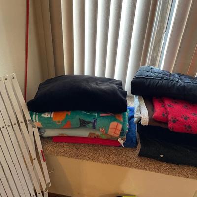 Dog blankets and bed with gate and pointer