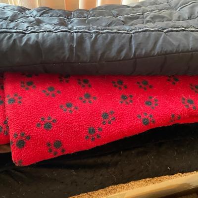 Dog blankets and bed with gate and pointer