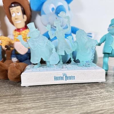 LOT 45L: Disney Collection - 1970s Big Al Coin Bank, Woody Dolls, Hallmark Haunted Mansion Hitch Hiking Ghosts & More