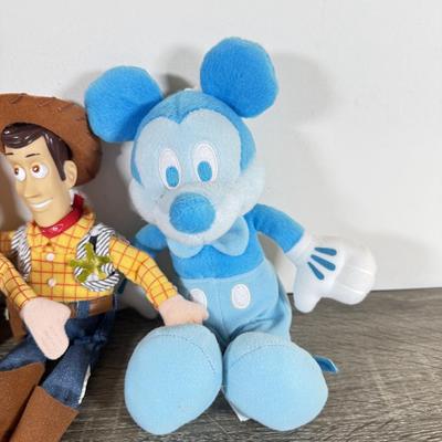 LOT 45L: Disney Collection - 1970s Big Al Coin Bank, Woody Dolls, Hallmark Haunted Mansion Hitch Hiking Ghosts & More