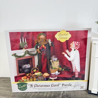 LOT 55M: Byer's Choice - 2012 Santa w/ Toys, 2006 Fireplace w/ Music Stand & A Christmas Carol Puzzle