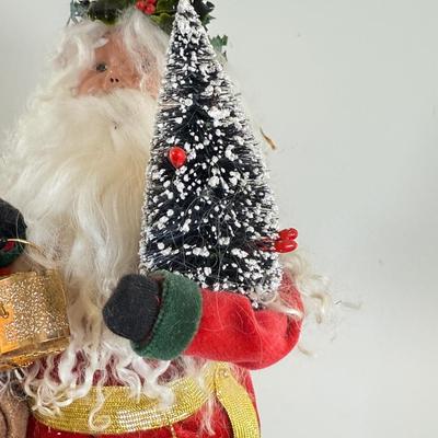 LOT 55M: Byer's Choice - 2012 Santa w/ Toys, 2006 Fireplace w/ Music Stand & A Christmas Carol Puzzle