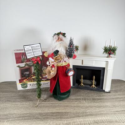 LOT 55M: Byer's Choice - 2012 Santa w/ Toys, 2006 Fireplace w/ Music Stand & A Christmas Carol Puzzle