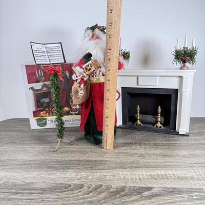 LOT 55M: Byer's Choice - 2012 Santa w/ Toys, 2006 Fireplace w/ Music Stand & A Christmas Carol Puzzle