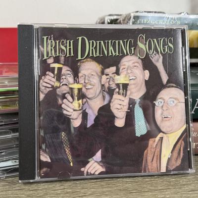 LOT 74M: Ireland Nyl-Glo Flag, Fitzgerald's Irish Turf, Hallmark Keepsake Ornaments w/ Boxes, Irish / Celtic Music CDs & More