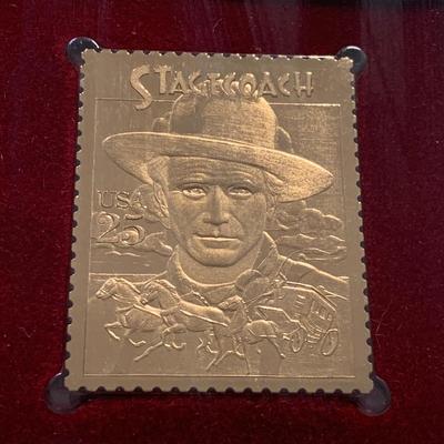 LOT 92 M: Framed John Wayne Collection: First Day Issue Stagecoach Stamp, Limited Edition Film Cells, Rio Bravo "Dynamite"...