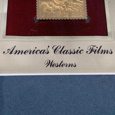 LOT 92 M: Framed John Wayne Collection: First Day Issue Stagecoach Stamp, Limited Edition Film Cells, Rio Bravo "Dynamite"...