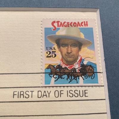 LOT 92 M: Framed John Wayne Collection: First Day Issue Stagecoach Stamp, Limited Edition Film Cells, Rio Bravo "Dynamite"...