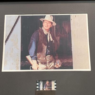 LOT 92 M: Framed John Wayne Collection: First Day Issue Stagecoach Stamp, Limited Edition Film Cells, Rio Bravo "Dynamite"...