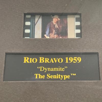 LOT 92 M: Framed John Wayne Collection: First Day Issue Stagecoach Stamp, Limited Edition Film Cells, Rio Bravo "Dynamite"...