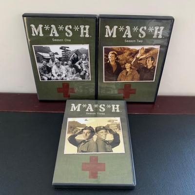 LOT 94 M: M*A*S*H Collection; Coffee Mug, Iron On Patch, DVD's Season 1 - 11, & Framed Infograph