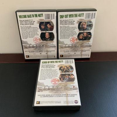 LOT 94 M: M*A*S*H Collection; Coffee Mug, Iron On Patch, DVD's Season 1 - 11, & Framed Infograph