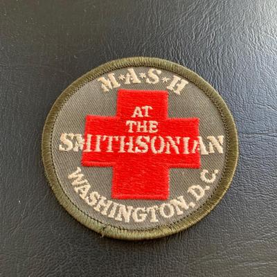 LOT 94 M: M*A*S*H Collection; Coffee Mug, Iron On Patch, DVD's Season 1 - 11, & Framed Infograph