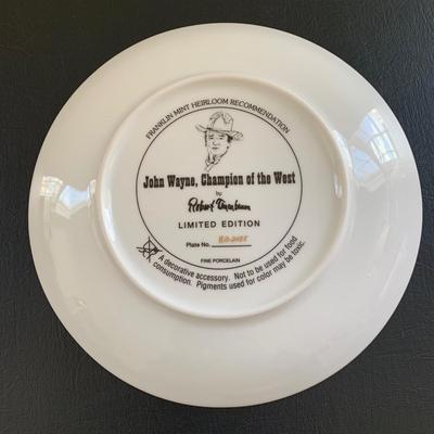 LOT 98 M: John Wayne Limited Edition Porcelain Plate Collection; Franklin Mint by Robert Tomenbaum; "The Legend Lives On",...