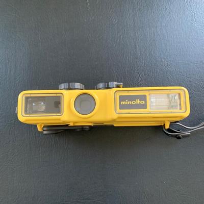 LOT 104 M: Minolta Underwater Cameras w/ Cases: Weathermatic Dual 35 Model #02354983 & Weathermatic A 110 Model #1040685