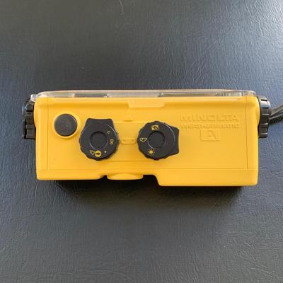 LOT 104 M: Minolta Underwater Cameras w/ Cases: Weathermatic Dual 35 Model #02354983 & Weathermatic A 110 Model #1040685
