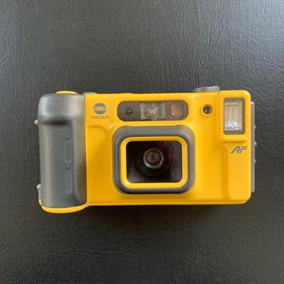 LOT 104 M: Minolta Underwater Cameras w/ Cases: Weathermatic Dual 35 Model #02354983 & Weathermatic A 110 Model #1040685