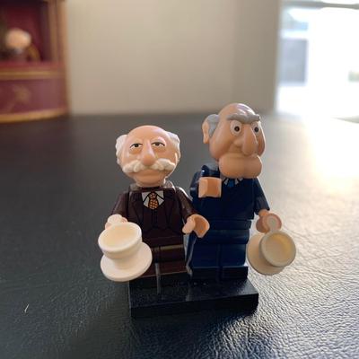 LOT 105 M: The Muppets Collection: Lego Figures, Posable Kermit w/ Banjo Figure, Statler & Waldorf in Balcony Figures, "The...