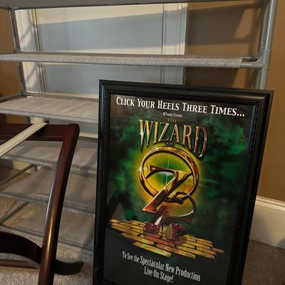 Sale Photo Thumbnail #425: MISC HOUSEHOLD LOT SHOE SHELF, ELECTRIC HEATER, LUGGAGE RACK, WIZRD OF OZ POSTER FRAMED 