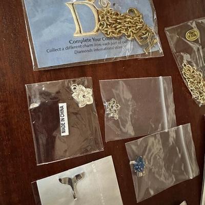 CHARM NECKALCE AND MISC CHARMS LOT