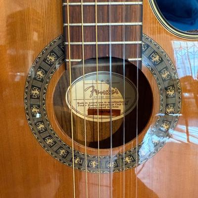 Sale Photo Thumbnail #69: The Fender CN-240SCE Thinline is an acoustic-electric guitar designed for intermediate players. It features a solid spruce body with a natural finish and a mahogany neck, complemented by a rosewood fretboard. This right-handed guitar is crafted in China a