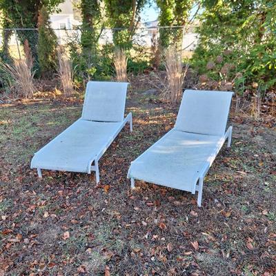 2 white lounge chairs