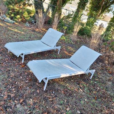 2 white lounge chairs