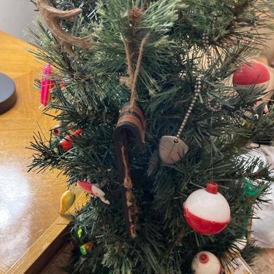 Small Christmas tree with fishing and hockey ornaments