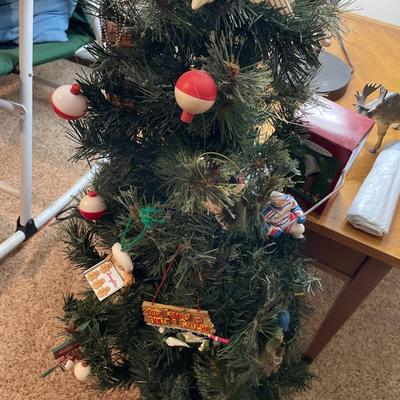 Small Christmas tree with fishing and hockey ornaments