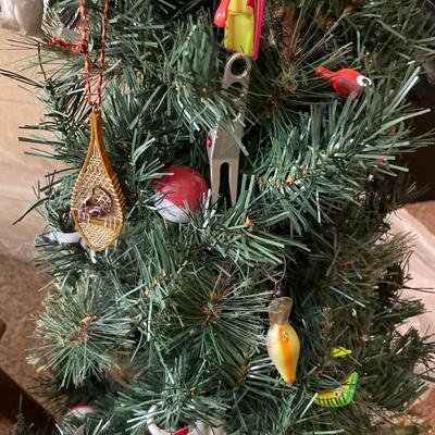 Small Christmas tree with fishing and hockey ornaments