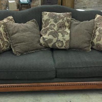 Fabric overstuffed sofa, green w/wood trim. 