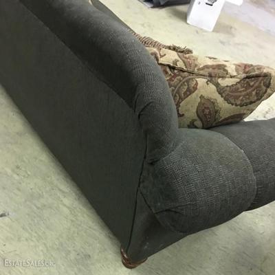 Fabric overstuffed sofa, green w/wood trim. 