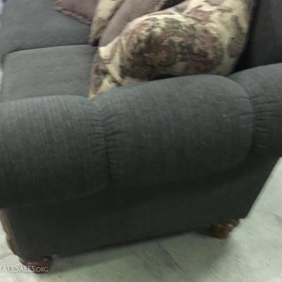 Fabric overstuffed sofa, green w/wood trim. 