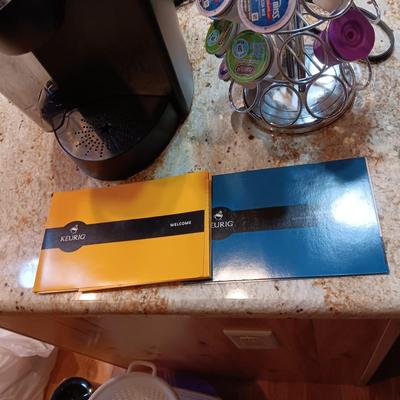 GENTLY USED KEURIG COFFEE MAKER PLUS ROTATING POD HOLDER