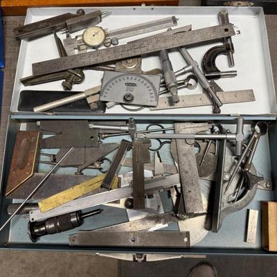 Metal box of vintage measuring tools