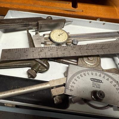 Metal box of vintage measuring tools