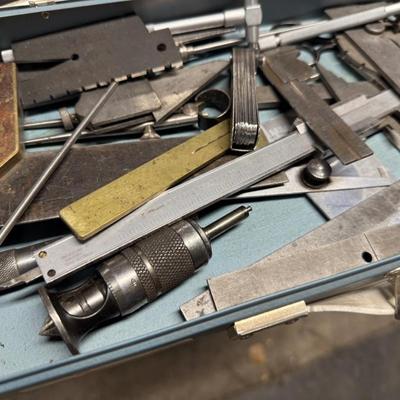 Metal box of vintage measuring tools
