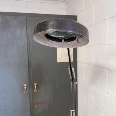 Black electric magnifying glass on swivel stand