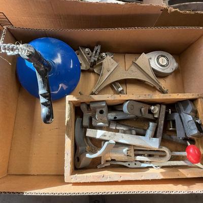 Box with 2 angle clamps/drain snake/chalk line & misc. machine parts