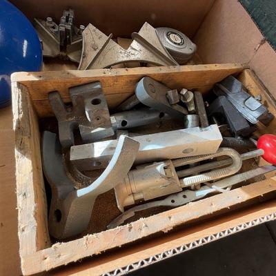 Box with 2 angle clamps/drain snake/chalk line & misc. machine parts