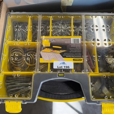 Stanley plastic tool box full of various hardware