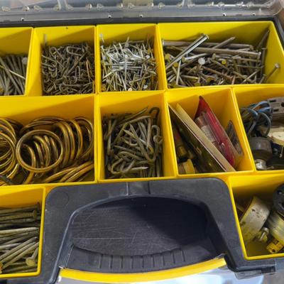 Stanley plastic tool box full of various hardware