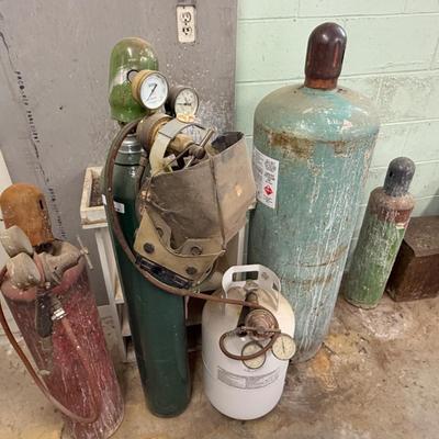 4 Welding Tanks/gauges/masks & hose as shown