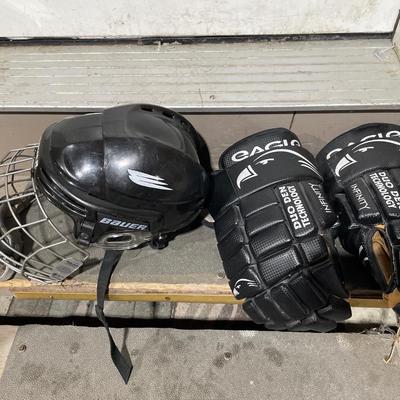 Hockey gloves, helmet and sticks