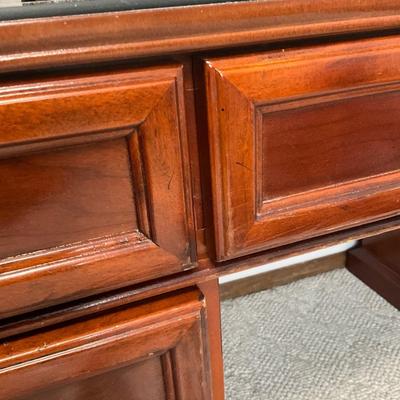 Sale Photo Thumbnail #269: B6-Large Office Desk

This desk is gorgeous, a very rich color, and in good shape. There is a thick glass surface on the top to protect the wood surface. This lot is for the desk only,