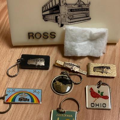 Greyhound bus keychains, money clip, and nameplate